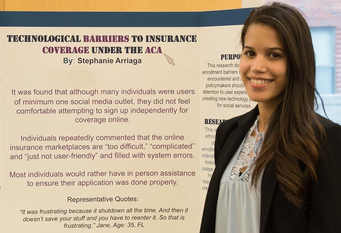 HPM student presenting a poster entitled "Technological Barriers to Insurance Coverage Under the ACA"