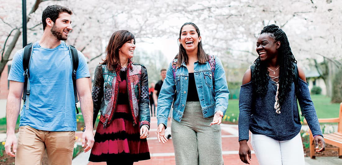students and professor on campus